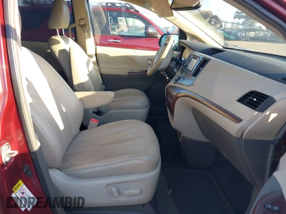 2014 Toyota Sienna XLE with VIN 5TDYK3DCXES473671, listed as a IAAI auction lot 42243030 with 70,052 mi miles and . Bid and sale history available at DreamBid. Image 5.