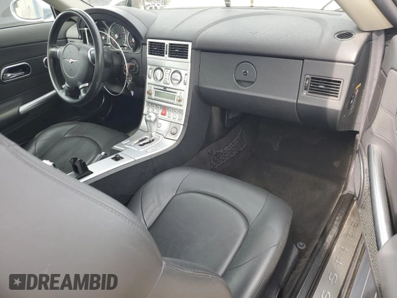 2004 Chrysler Crossfire z VIN 1C3AN69L14X024234, wystawiony jako Copart lot #51322415 z przebiegiem 70 243 mil mil oraz Szkoda całkowita • Salvage title. Historia ofert i sprzedaży dostępna na DreamBid. Obrazek 8.