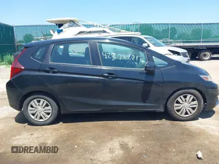 2015 Honda Fit LX z VIN 3HGGK5H56FM712266, wystawiony jako IAAI lot #42378228 z przebiegiem 140 423 mil mil oraz . Historia ofert i sprzedaży dostępna na DreamBid. Obrazek 13.