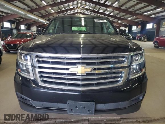 2015 Chevrolet Tahoe LS with VIN 1GNSCAKC9FR301715, listed as a Copart auction lot 64249005 with 107,240 mi miles and Clean title. Bid and sale history available at DreamBid. Image 5.