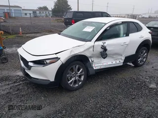 2021 Mazda CX-30 Select with VIN 3MVDMBBL3MM205256, listed as a IAAI auction lot 41302313 with 17,709 mi miles and . Bid and sale history available at DreamBid. Image 2.