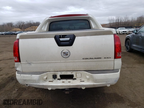 2003 Cadillac Escalade EXT z VIN 3GYEK63N13G145634, wystawiony jako Copart lot #47593375 z przebiegiem 287 512 mil mil oraz Nie do naprawy. Historia ofert i sprzedaży dostępna na DreamBid. Obrazek 6.