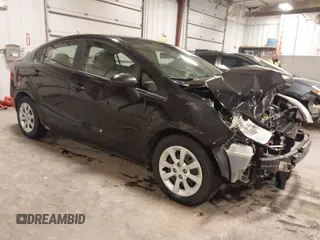 2014 Kia Rio LX with VIN KNADM4A32E6409785, listed as a IAAI auction lot 41810262 with 183,669 mi miles. Bid and sale history available at carsss.com. Image 1.
