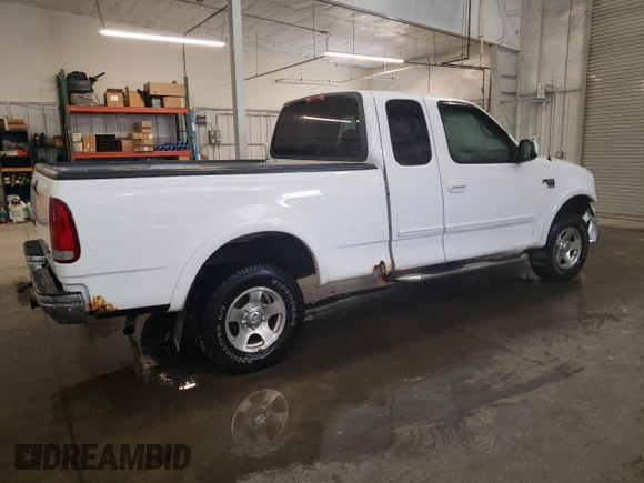 1999 Ford F-150 XL with VIN 2FTRX18L1XCA22096, listed as a Copart auction lot 52402885 with 120,254 mi miles and Salvage Title. Bid and sale history available at carsss.com. Image 3.