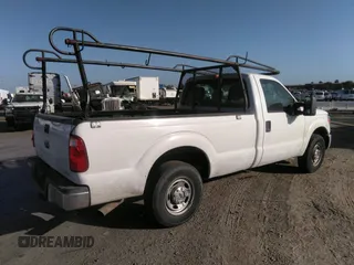 2014 Ford Super Duty F-250 SRW XL with VIN 1FTBF2A6XEEB79132, listed as a IAAI auction lot 39455654 with 180,128 mi miles. Bid and sale history available at carsss.com. Image 4.