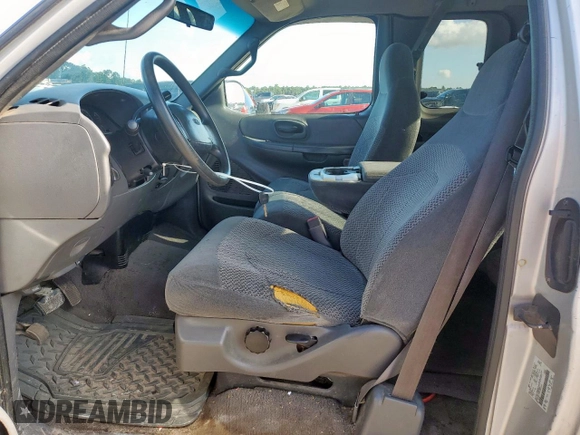 2000 Ford F-150 XL с VIN 1FTRX17L6YKB45245, выставлен на аукционе Copart как лот 62365195 с пробегом 306 210 миль миль и Списание • Salvage title. История ставок и продаж доступна на DreamBid. Изображение 7.