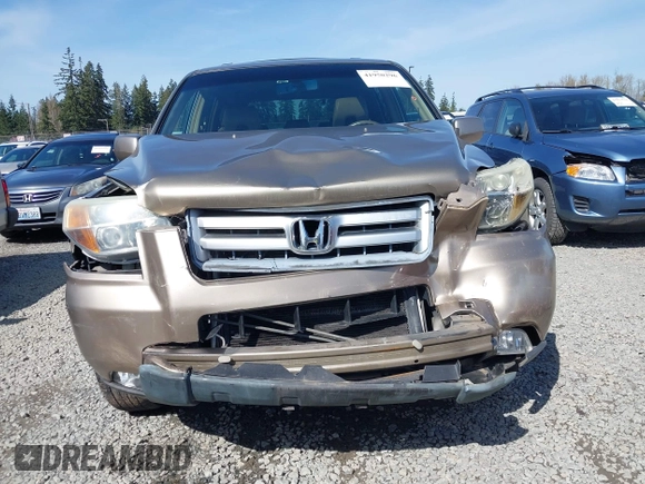 2006 Honda Pilot EX-L with VIN 2HKYF18566H561371, listed as a IAAI auction lot 41950296 with 145,579 mi miles and . Bid and sale history available at DreamBid. Image 12.