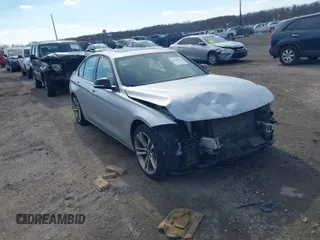2014 BMW 3 Series 328i xDrive with VIN WBA3B3C58EJ980379, listed as a IAAI auction lot 41678676 with 183,278 mi miles. Bid and sale history available at carsss.com. Image 1.