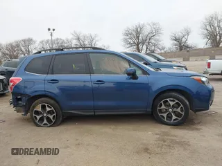 2014 Subaru Forester XT Touring with VIN JF2SJGMC9EH428341, listed as a IAAI auction lot 41185804 with 111,000 mi miles and . Bid and sale history available at DreamBid. Image 13.