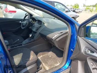 2018 Ford Focus SE z VIN 1FADP3FE1JL254632, wystawiony jako IAAI lot #42408683 z przebiegiem 74 696 mil mil oraz . Historia ofert i sprzedaży dostępna na DreamBid. Obrazek 5.