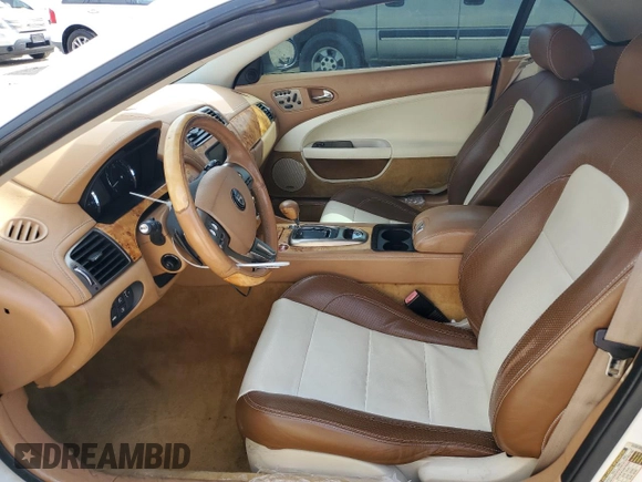 2007 Jaguar XK with VIN SAJDA44B775B05606, listed as a Copart auction lot 49419515 with 115,607 mi miles and Salvage Title. Bid and sale history available at DreamBid. Image 7.