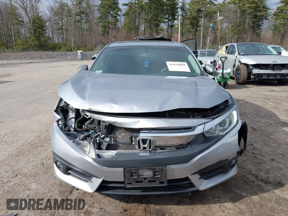 2018 Honda Civic EX-T z VIN 2HGFC1F34JH641837, wystawiony jako IAAI lot #41858089 z przebiegiem 65 318 mil mil oraz . Historia ofert i sprzedaży dostępna na DreamBid. Obrazek 12.