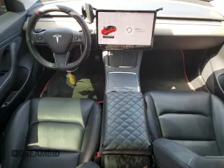 2021 Tesla Model 3 Standard Range Plus with VIN 5YJ3E1EA7MF915053, listed as a Copart auction lot 51172815 with 69,303 mi miles and Salvage Title. Bid and sale history available at DreamBid. Image 8.