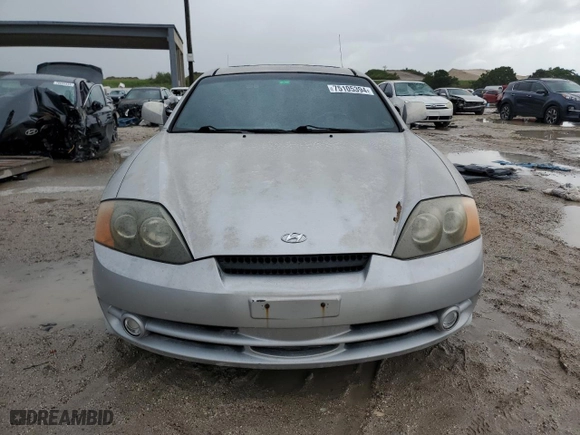 2003 Hyundai Tiburon GT with VIN KMHHN65F23U084299, listed as a Copart auction lot 75105394 with 90,598 mi miles and Clean Title. Bid and sale history available at carsss.com. Image 5.