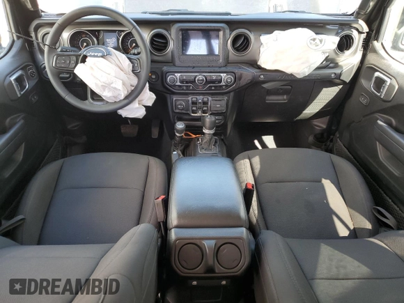 2023 Jeep Wrangler Sport with VIN 1C4HJXDNXPW701795, listed as a Copart auction lot 50451444 with 7,274 mi miles and Salvage Title. Bid and sale history available at DreamBid. Image 8.