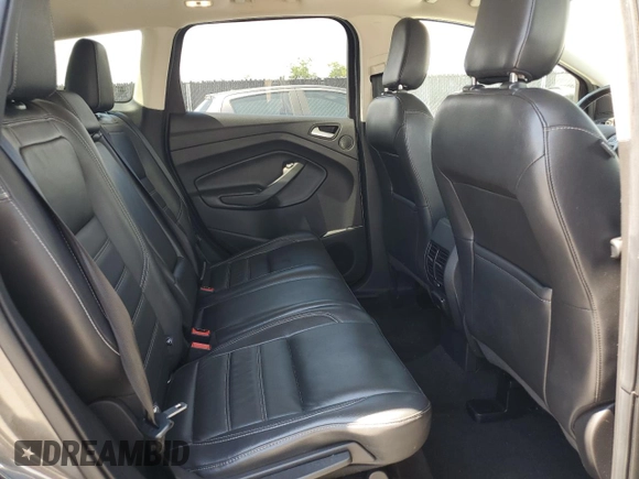2019 Ford Escape Titanium z VIN 1FMCU9J96KUA65154, wystawiony jako Copart lot #63932325 z przebiegiem 117 963 mil mil oraz Czysty tytuł • Clean title. Historia ofert i sprzedaży dostępna na DreamBid. Obrazek 11.