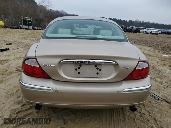 2003 Jaguar S-Type z VIN SAJEA01U33HM71782, wystawiony jako Copart lot #82969304 z przebiegiem 127 176 mil mil oraz Szkody całkowita. Historia ofert i sprzedaży dostępna na DreamBid. Obrazek 6.