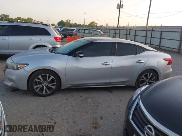 2016 Nissan Maxima SR z VIN 1N4AA6AP9GC382348, wystawiony jako IAAI lot #42012121 z przebiegiem 203 513 mil mil oraz . Historia ofert i sprzedaży dostępna na DreamBid. Obrazek 13.