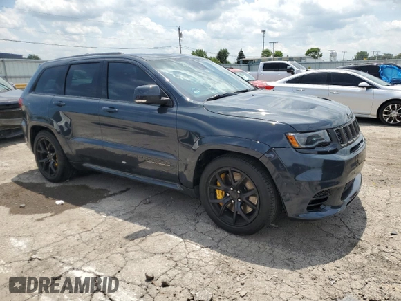 2018 Jeep Grand Cherokee Trackhawk with VIN 1C4RJFN99JC309254, listed as a Copart auction lot 64061615 with 104,558 mi miles and Clean title. Bid and sale history available at DreamBid. Image 4.