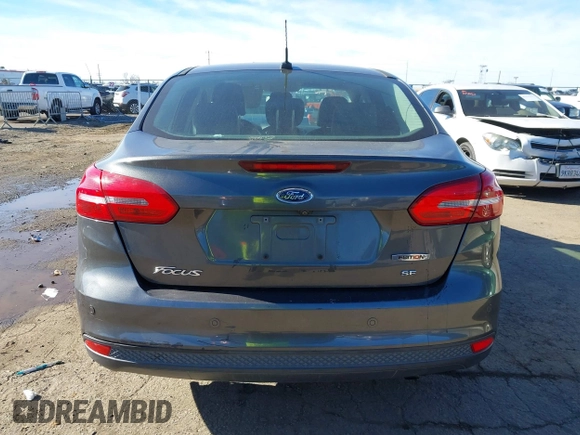 2016 Ford Focus SE z VIN 1FADP3F27GL321507, wystawiony jako IAAI lot #41278203 z przebiegiem 157 910 mil mil oraz . Historia ofert i sprzedaży dostępna na DreamBid. Obrazek 16.