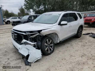 2025 Honda Pilot Touring with VIN 5FNYG2H76SB007454, listed as a Copart auction lot 88125485 with 10,065 mi miles and Salvage Title. Bid and sale history available at carsss.com. Image 1.