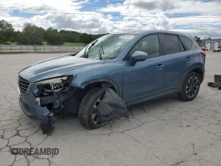 2016 Mazda CX-5 Grand Touring z VIN JM3KE4DY7G0705820, wystawiony jako Copart lot #58841835 z przebiegiem 111 161 mil mil oraz Szkoda całkowita • Salvage title. Historia ofert i sprzedaży dostępna na DreamBid. Obrazek 1.