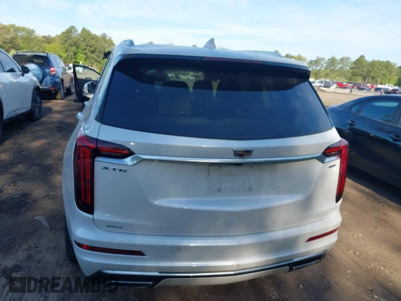 2022 Cadillac XT6 Premium Luxury z VIN 1GYKPDRS3NZ124924, wystawiony jako IAAI lot #42215418 z przebiegiem 32 368 mil mil oraz . Historia ofert i sprzedaży dostępna na DreamBid. Obrazek 6.