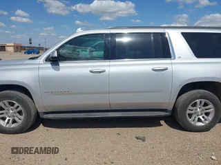 2017 Chevrolet Suburban LT with VIN 1GNSCHKC9HR287701, listed as a IAAI auction lot 42510491 with 166,568 mi miles and . Bid and sale history available at DreamBid. Image 14.