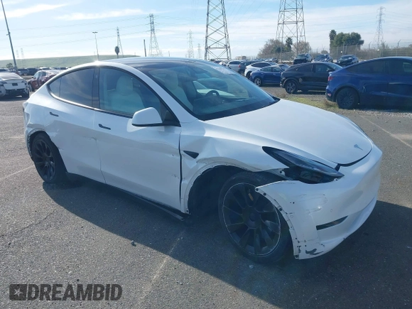 2021 Tesla Model Y Standard Range z VIN 5YJYGDED4MF123311, wystawiony jako IAAI lot #41200519 z przebiegiem 70 190 mil mil oraz . Historia ofert i sprzedaży dostępna na DreamBid. Obrazek 1.