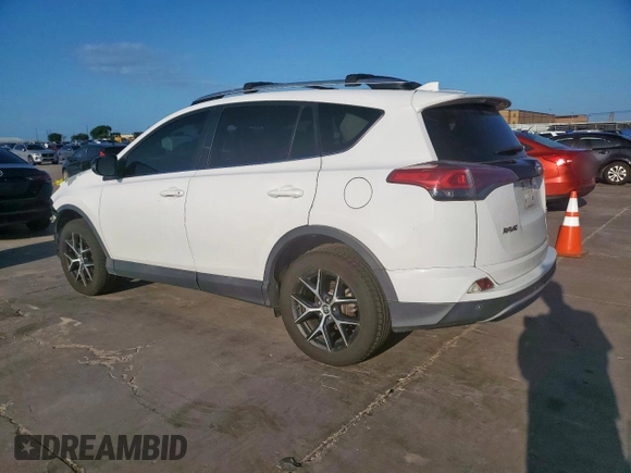 2016 Toyota RAV4 SE with VIN 2T3JFREV2GW456003, listed as a Copart auction lot 64136325 with 133,746 mi miles and Salvage title. Bid and sale history available at DreamBid. Image 2.