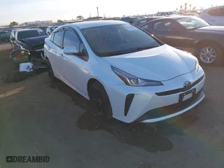 2021 Toyota Prius L Eco with VIN JTDKAMFU8M3132998, listed as a IAAI auction lot 41227212 with 64,681 mi miles. Bid and sale history available at carsss.com. Image 1.
