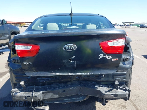2014 Kia Rio LX with VIN KNADM4A39E6364490, listed as a IAAI auction lot 42128702 with 130,981 mi miles and . Bid and sale history available at DreamBid. Image 6.