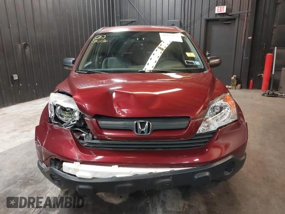 2009 Honda CR-V LX with VIN JHLRE48339C018957, listed as a IAAI auction lot 41952951 with 76,502 mi miles. Bid and sale history available at carsss.com. Image 12.