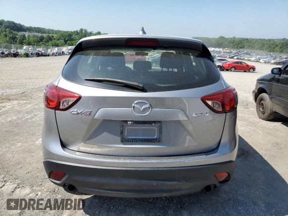 2014 Mazda CX-5 Sport with VIN JM3KE2BE7E0334880, listed as a Copart auction lot 61780635 with 96,926 mi miles and Salvage title. Bid and sale history available at DreamBid. Image 6.
