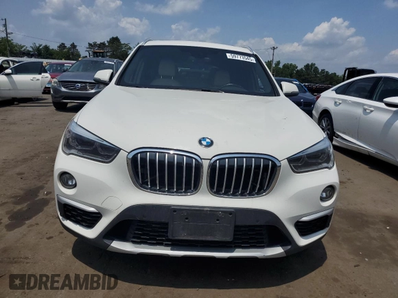 2017 BMW X1 xDrive28i with VIN WBXHT3Z3XH4A55624, listed as a Copart auction lot 59773545 with 140,251 mi miles and Salvage title. Bid and sale history available at DreamBid. Image 5.