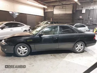 2001 Lexus ES 300 z VIN JT8BF28G415112517, wystawiony jako IAAI lot #42208849 z przebiegiem 202 029 mil mil oraz . Historia ofert i sprzedaży dostępna na DreamBid. Obrazek 14.