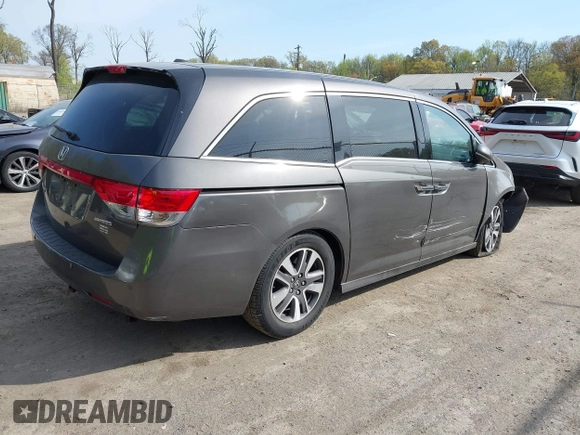 2014 Honda Odyssey Touring with VIN 5FNRL5H92EB073085, listed as a IAAI auction lot 42065913 with 120,834 mi miles and . Bid and sale history available at DreamBid. Image 4.