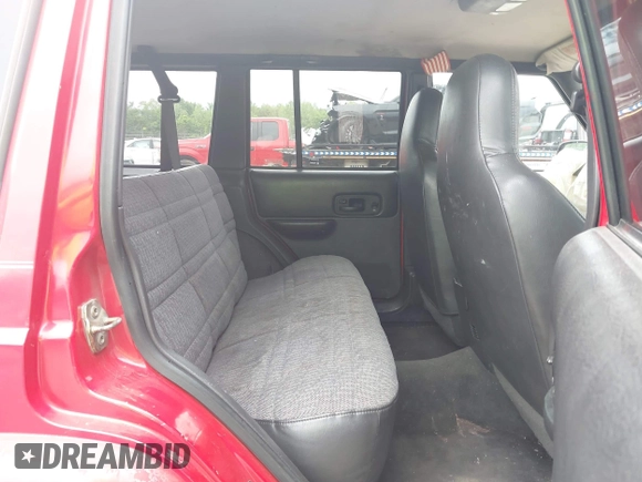 1999 Jeep Cherokee Sport z VIN 1J4FT68S9XL667355, wystawiony jako IAAI lot #42204435 z przebiegiem 217 178 mil mil oraz . Historia ofert i sprzedaży dostępna na DreamBid. Obrazek 8.