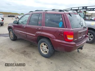 1999 Jeep Grand Cherokee Limited with VIN 1J4GW68N3XC696825, listed as a IAAI auction lot 42117857 with 236,300 mi miles. Bid and sale history available at carsss.com. Image 3.