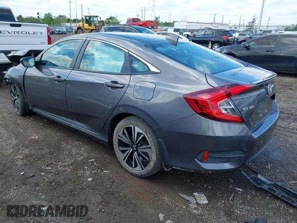 2018 Honda Civic EX-T z VIN 2HGFC1F34JH643975, wystawiony jako IAAI lot #42209799 z przebiegiem 58 684 mil mil oraz . Historia ofert i sprzedaży dostępna na DreamBid. Obrazek 3.