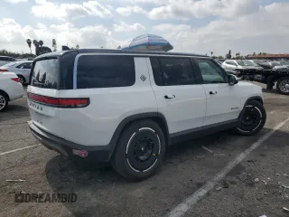 2025 Rivian R1S Adventure z VIN 7PDSGBBA1SN051768, wystawiony jako Copart lot #43838115 z przebiegiem 4875 mil mil oraz Szkoda całkowita • Salvage title. Historia ofert i sprzedaży dostępna na DreamBid. Obrazek 3.