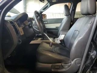 2010 Mercury Mariner Premier with VIN 4M2CN9HG3AKJ25675, listed as a Copart auction lot 64546635 with 99,620 mi miles and Salvage title. Bid and sale history available at DreamBid. Image 7.