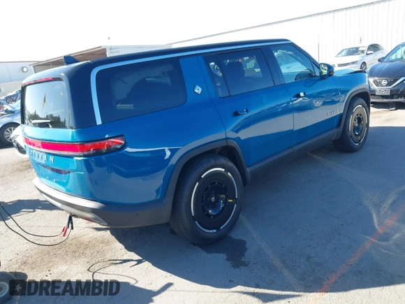 2025 Rivian R1S Adventure with VIN 7PDSGBBA9SN056202, listed as a IAAI auction lot 40766927 with 1,688 mi miles. Bid and sale history available at carsss.com. Image 4.