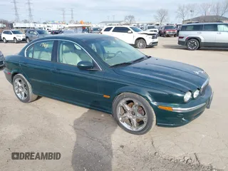2002 Jaguar X-Type with VIN SAJEA51C42WC54128, listed as a IAAI auction lot 41561364 with 128,847 mi miles. Bid and sale history available at carsss.com. Image 1.