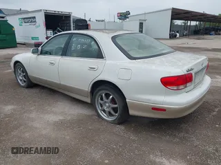 2001 Mazda Millenia S z VIN JM1TA222811710618, wystawiony jako IAAI lot #42292915 z przebiegiem 69 444 mil mil oraz . Historia ofert i sprzedaży dostępna na DreamBid. Obrazek 3.