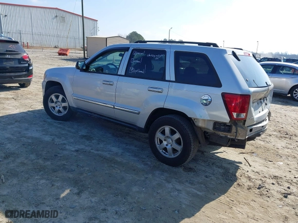 2010 Jeep Grand Cherokee Laredo with VIN 1J4PS4GK2AC155683, listed as a IAAI auction lot 41411133 with 211,803 mi miles. Bid and sale history available at carsss.com. Image 3.