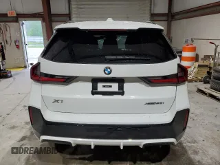 2023 BMW X1 xDrive28i with VIN WBX73EF08P5X60980, listed as a Copart auction lot 59899385 with 21,975 mi miles and Salvage title. Bid and sale history available at DreamBid. Image 6.