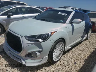 2016 Hyundai Veloster Turbo z VIN KMHTC6AEXGU261247, wystawiony jako Copart lot #52240215 z przebiegiem 137 238 mil mil oraz Czysty tytuł • Clean title. Historia ofert i sprzedaży dostępna na DreamBid. Obrazek 1.