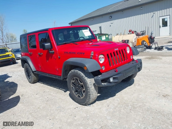 2015 Jeep Wrangler Unlimited Rubicon Hard Rock with VIN 1C4HJWFG9FL525556, listed as a IAAI auction lot 41973576 with 246,949 mi miles. Bid and sale history available at carsss.com. Image 1.