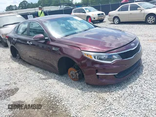 2016 Kia Optima LX z VIN 5XXGT4L3XGG040050, wystawiony jako IAAI lot #42363633 z przebiegiem 156 999 mil mil oraz . Historia ofert i sprzedaży dostępna na DreamBid. Obrazek 1.